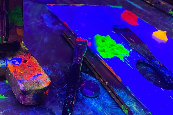 Paint a neon fluorescent picture while drinking unlimited wine - Unlimited wine and water: fun, not just free booze