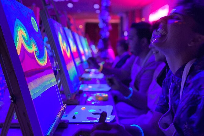 Paint a neon fluorescent picture while drinking unlimited wine - Taking your canvas home: the keepsake factor