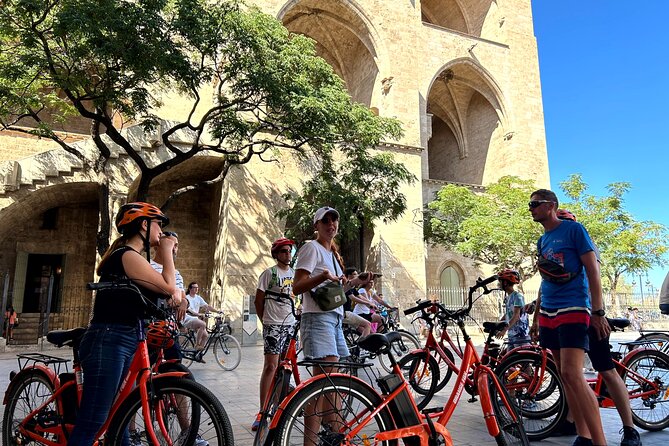Valencia City Highlights in Guided Bike or E-Bike Tour - La Lonja de la Seda, then Plaça de la Reina: UNESCO plus city buzz